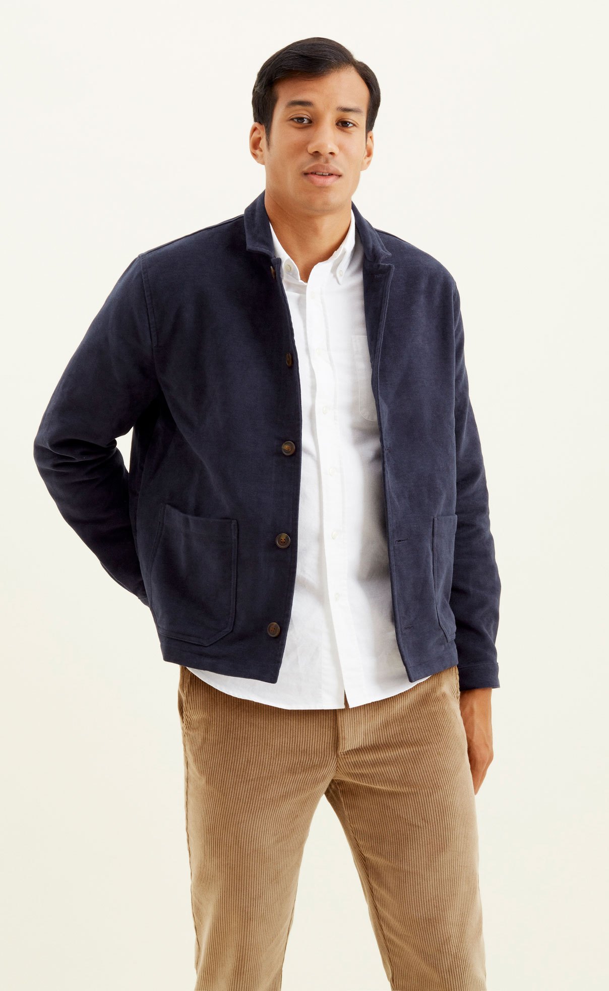 Navy blue moleskin jacket with button closures and chest pockets