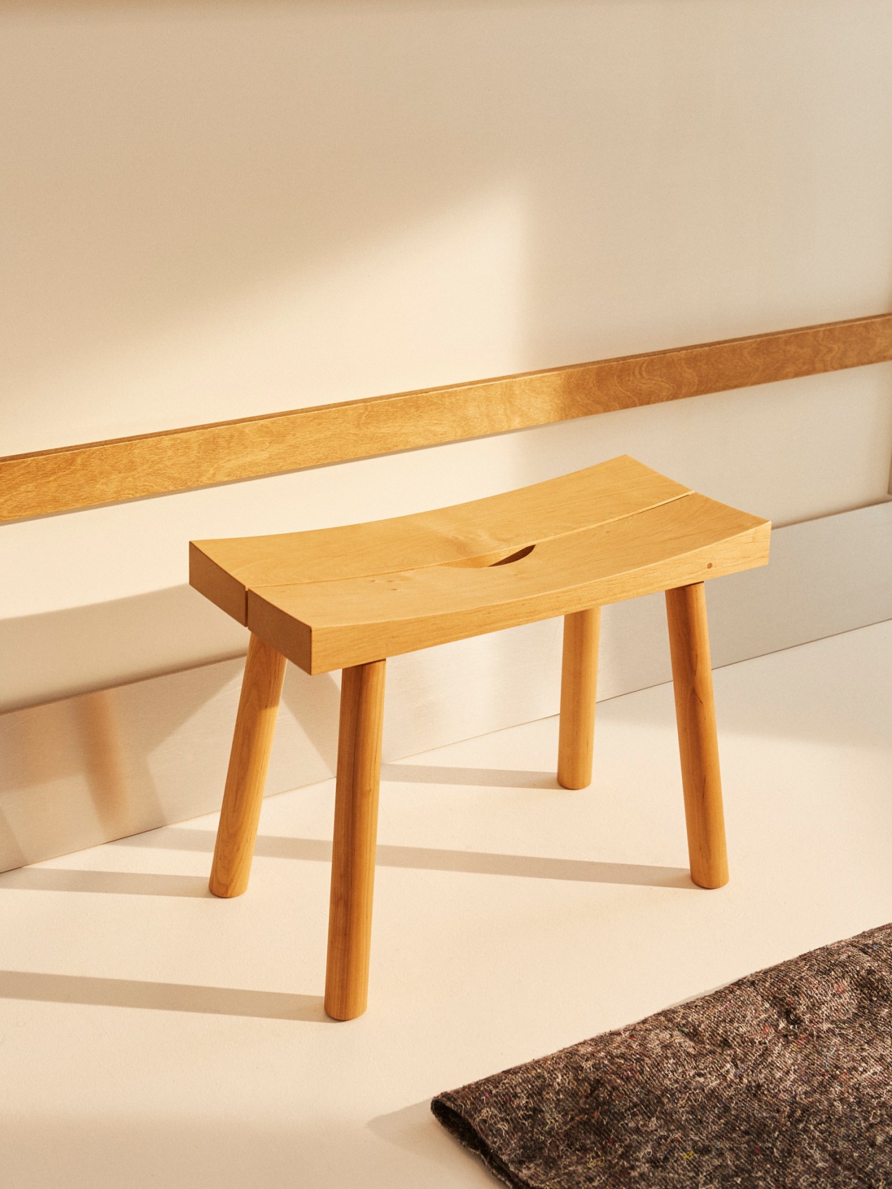 Periferia sauna stool made from sturdy alder wood with slightly concave seat showing natural wood grain