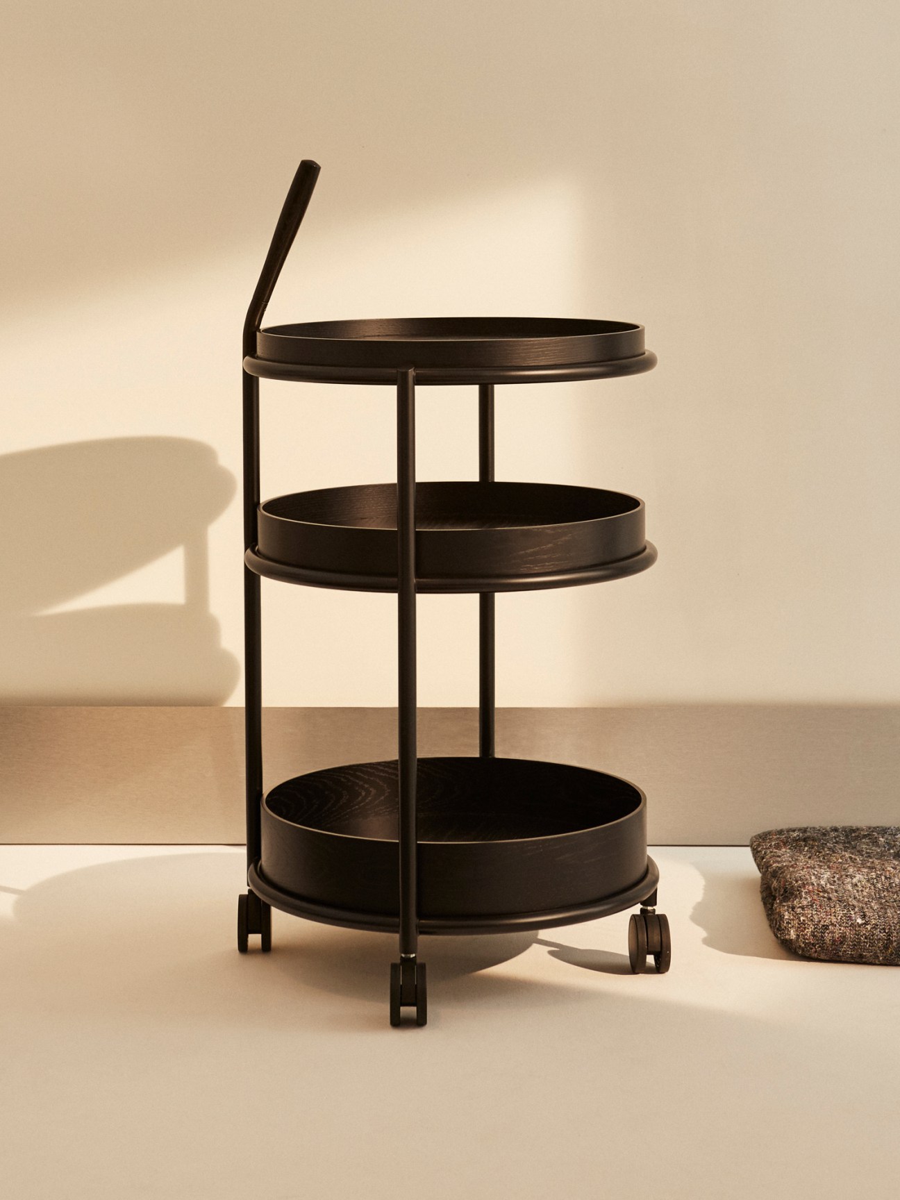 K6 Trolley with three-tiered black cylindrical containers on wheeled chrome frame with handle