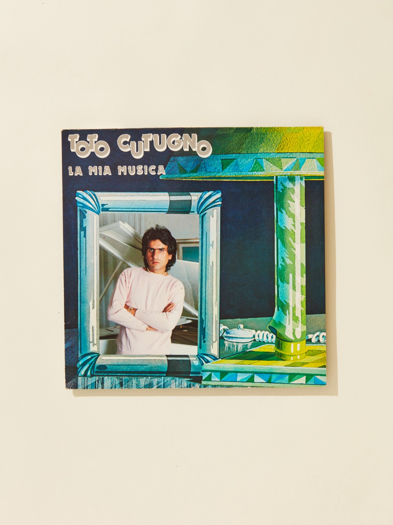 Toto Cutugno's 1981 album cover 'La Mia Musica' featuring the singer in a pink shirt at a window.