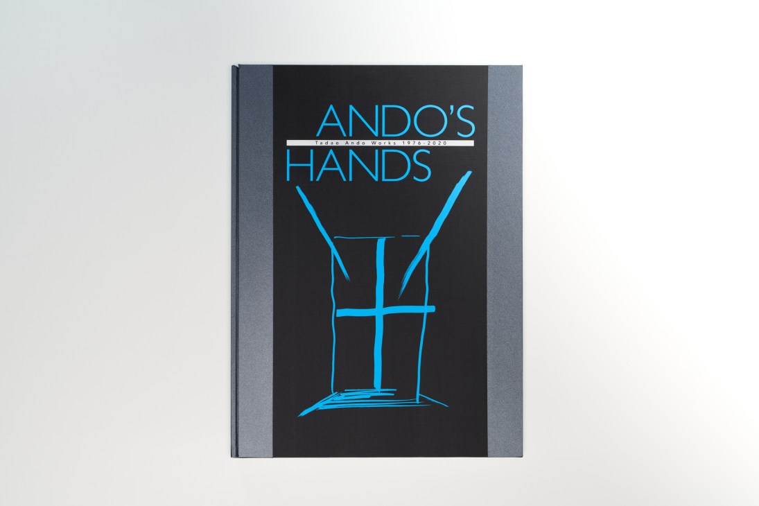 Cover of Ando's Hands monograph featuring blue line drawing of a chair on black background