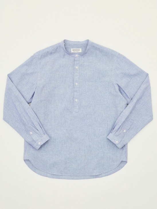 Lightweight cotton and linen grandad-collar shirt by Monocle in light blue, displayed flat against a neutral background.