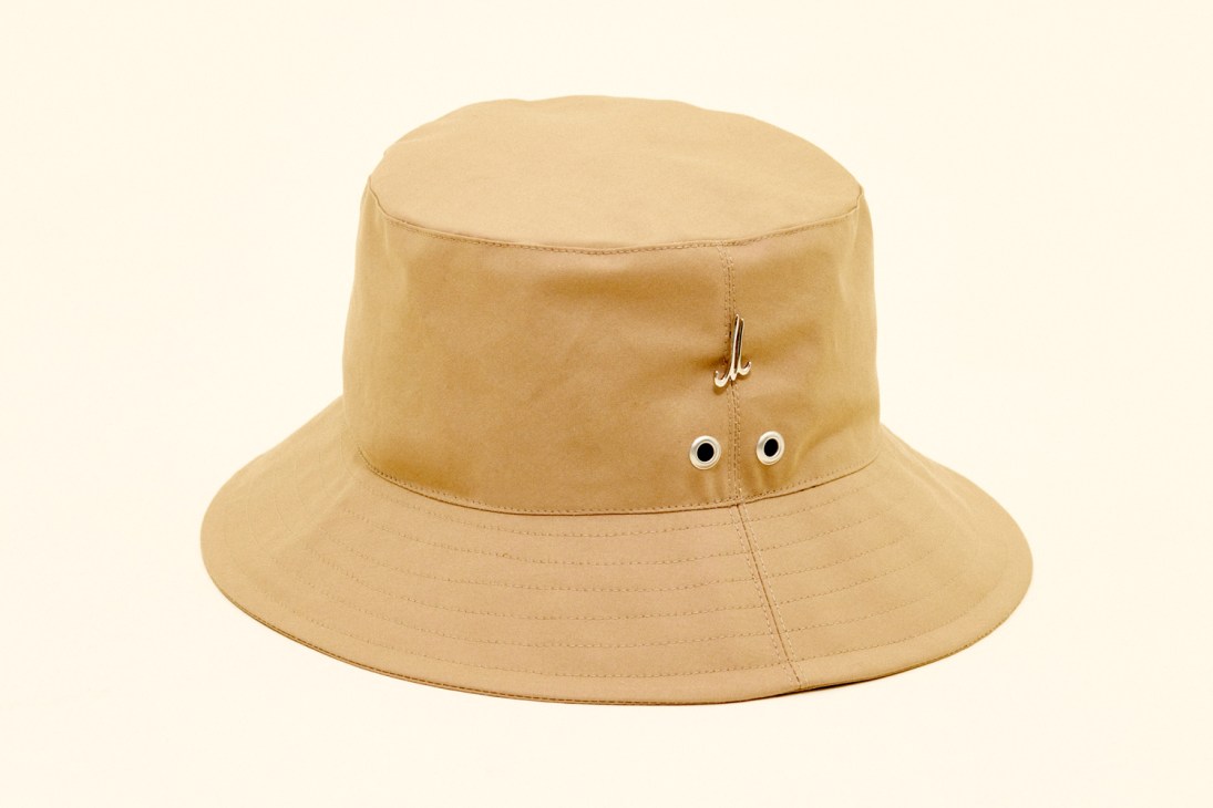 Beige Mühlbauer x Monocle tennis hat with small eyelets and metal hook detail