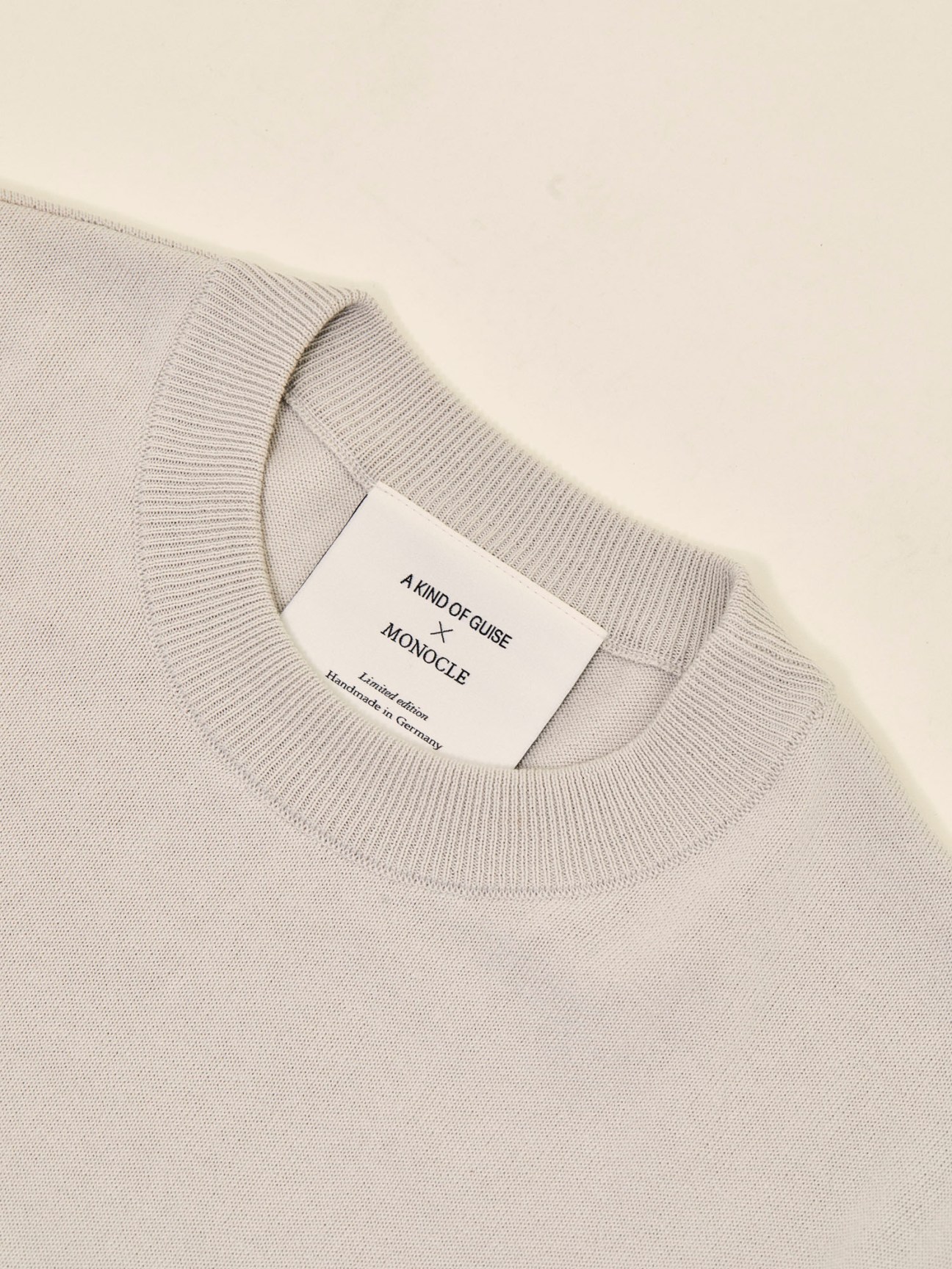 Stone colored A Kind of Guise cotton crewneck pullover with ribbed collar displayed flat