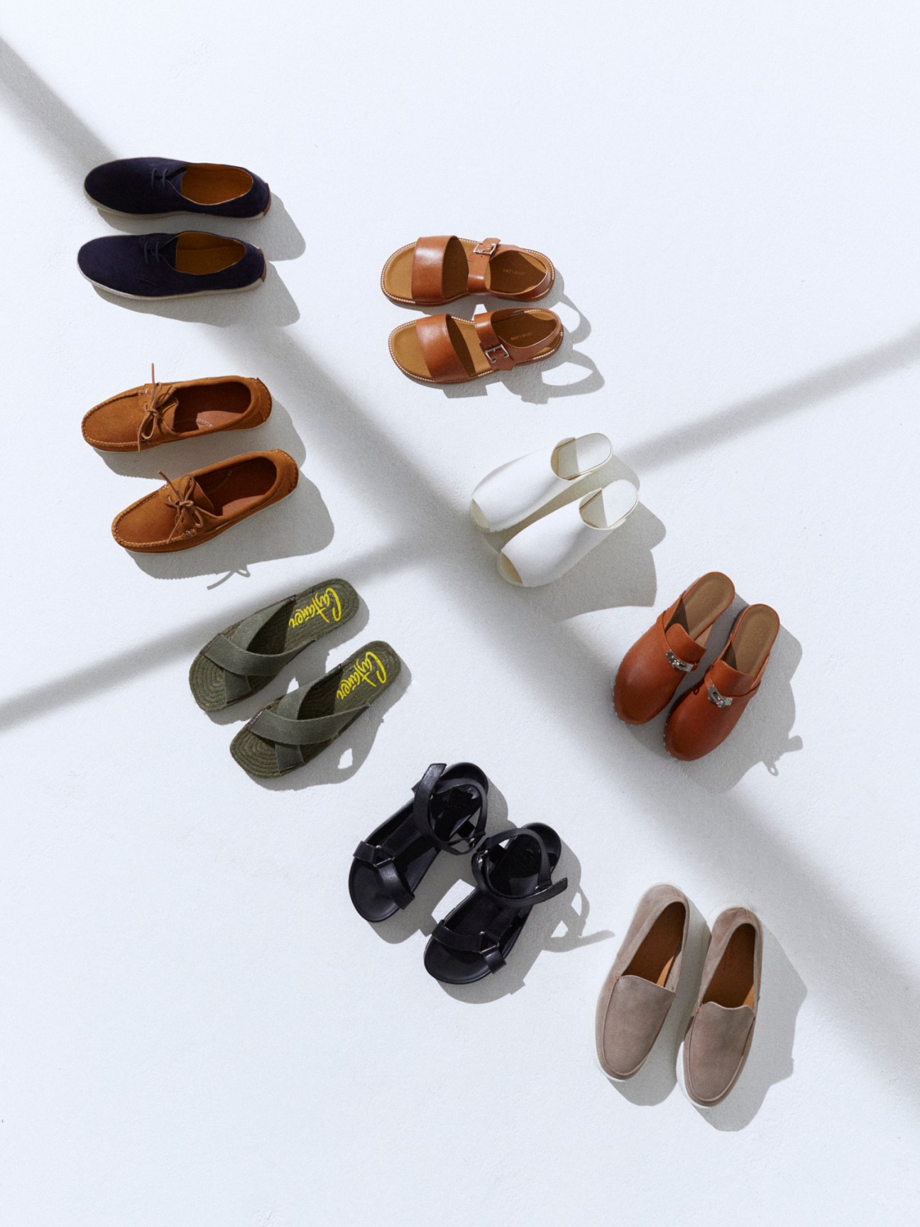 Collection of summer footwear including clogs, sandals and espadrilles from various luxury brands