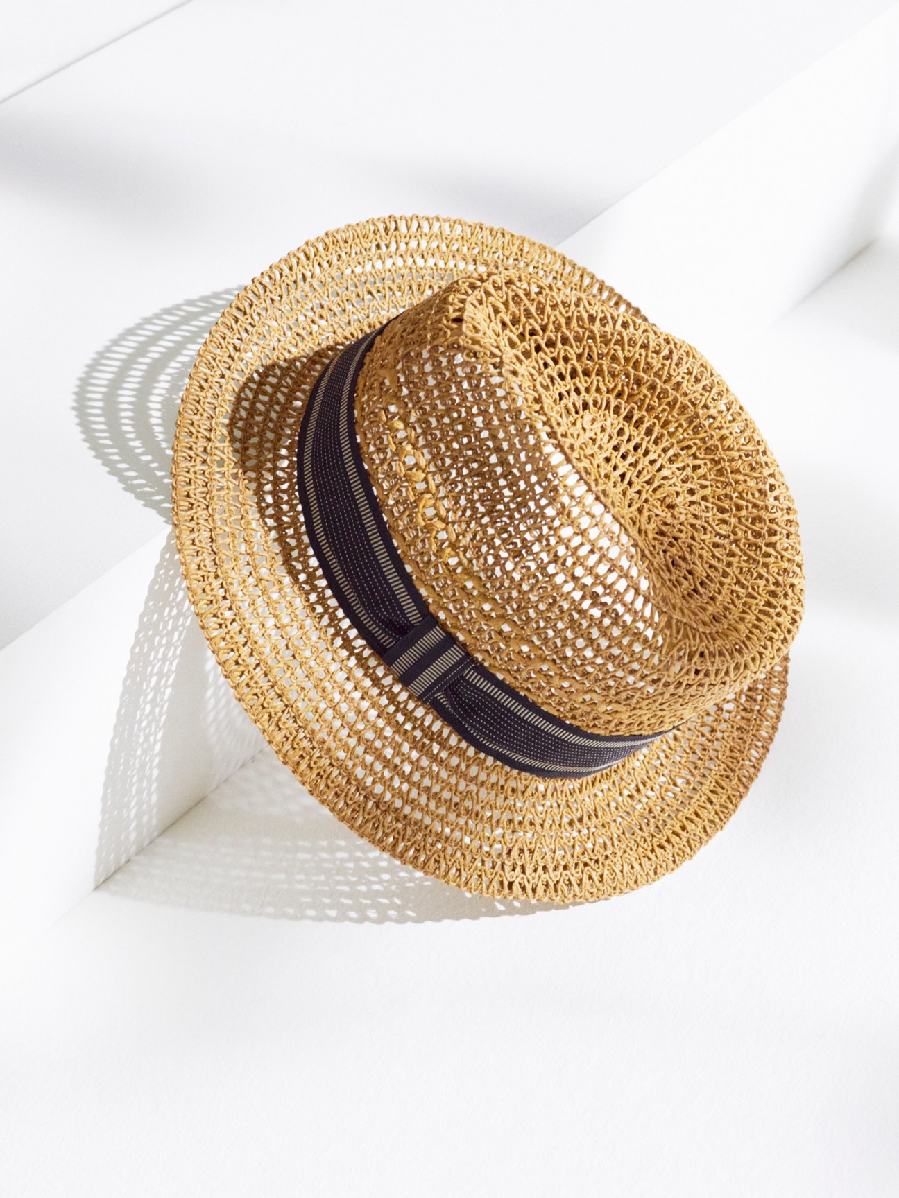 Natural straw panama hat with black band and traditional weave