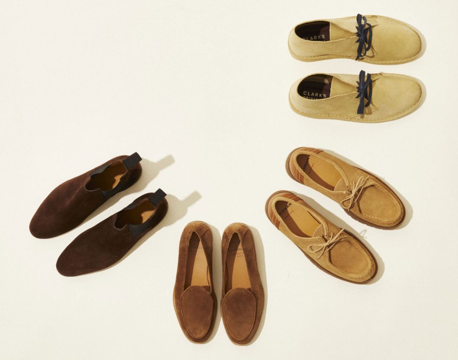 Collection of suede shoes and boots arranged in a circle on white background