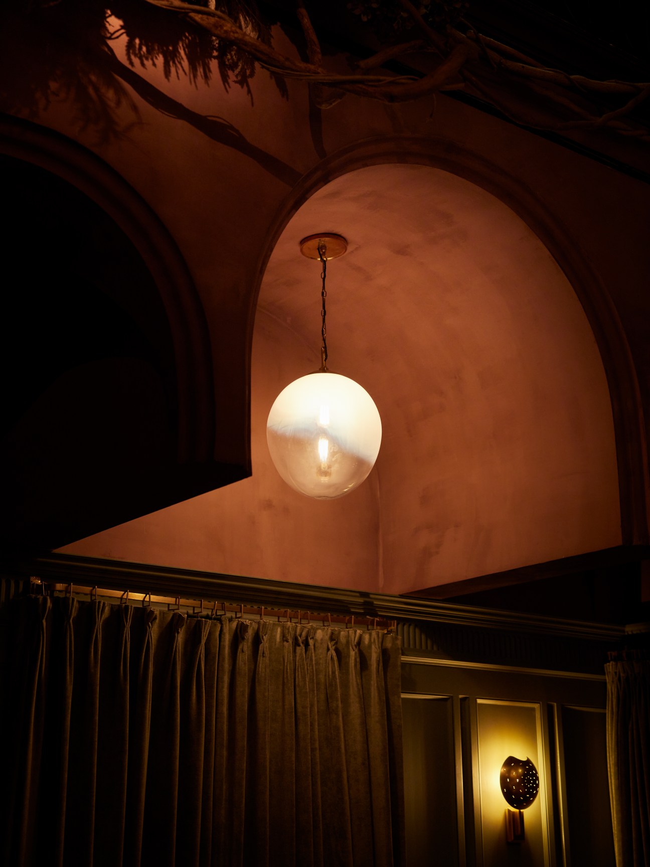 Chapel Bar interior showing ornate arched ceiling, pendant light fixture and historic church crypt architecture