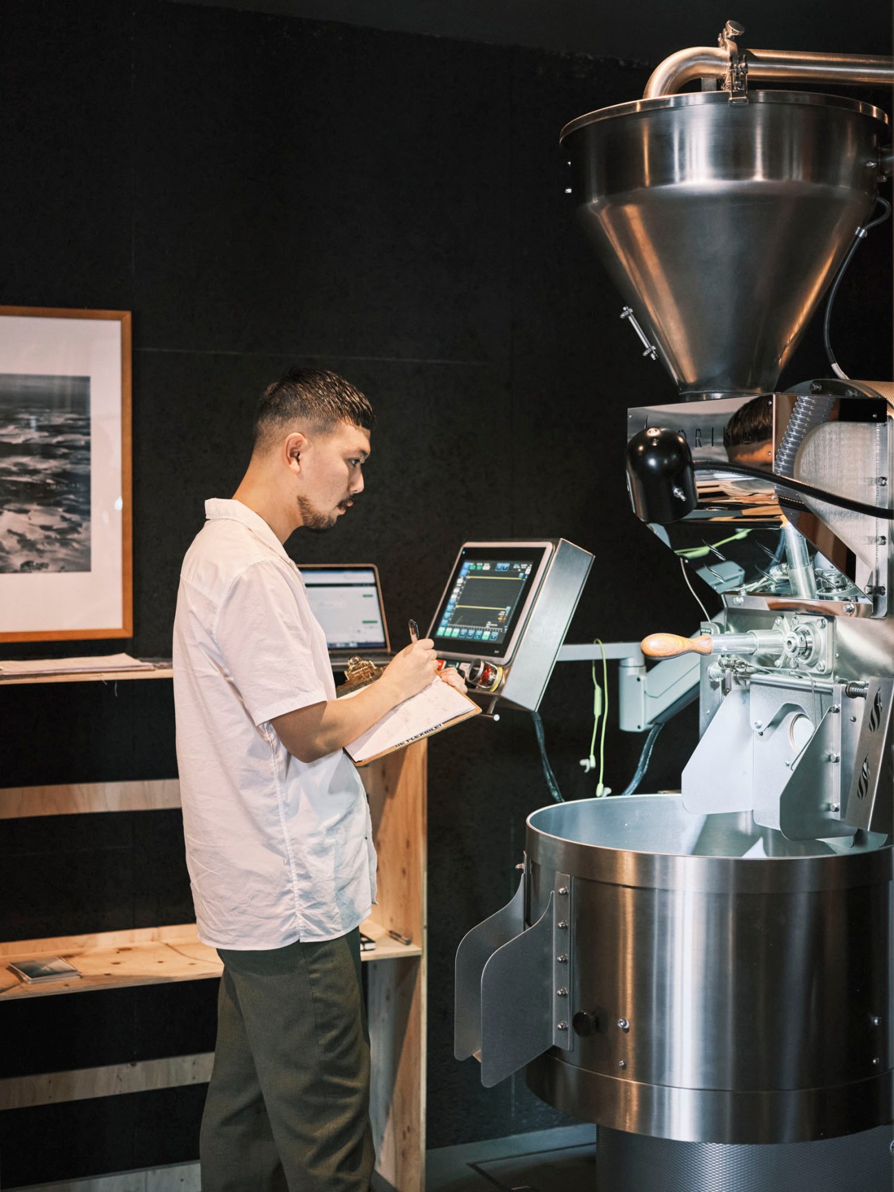 Keisuke Masuda operating professional coffee roasting equipment at Overview Coffee
