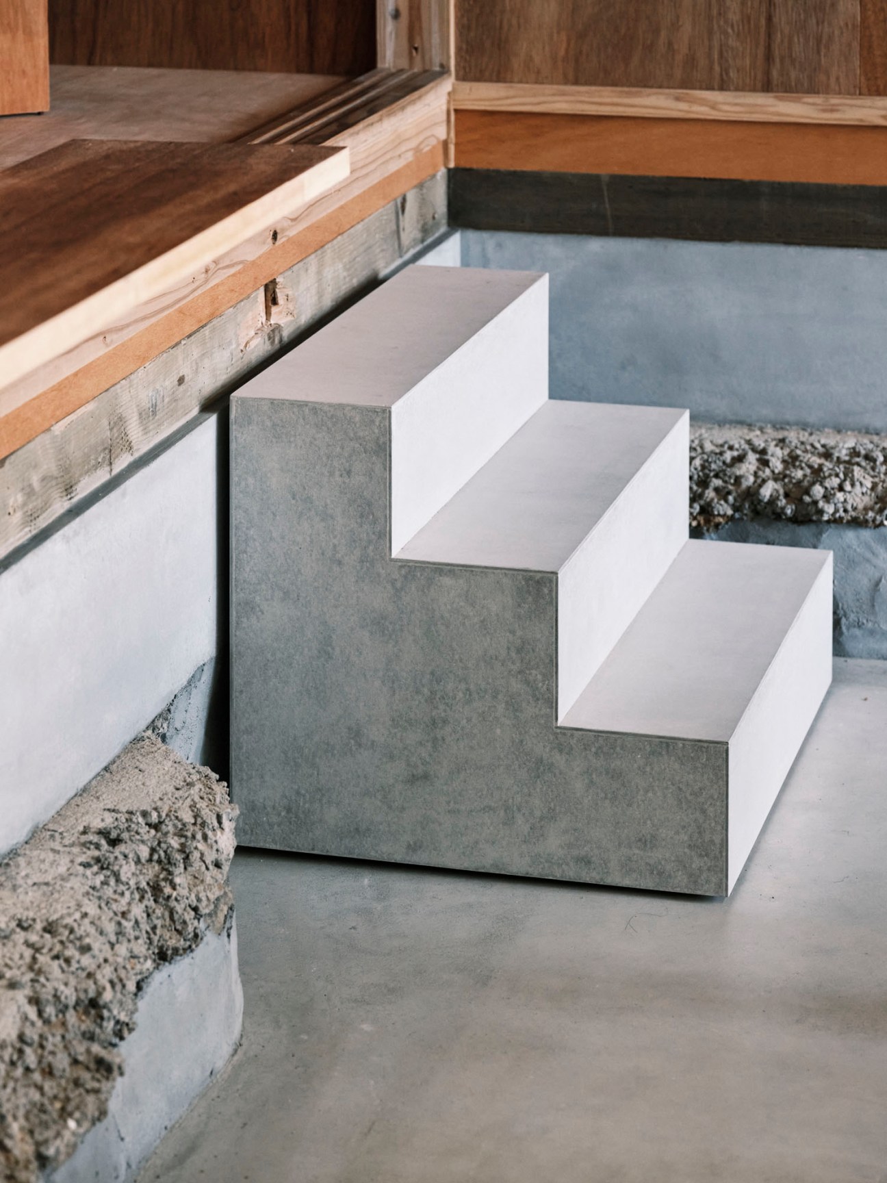 Concrete steps with geometric angular design in minimalist interior space