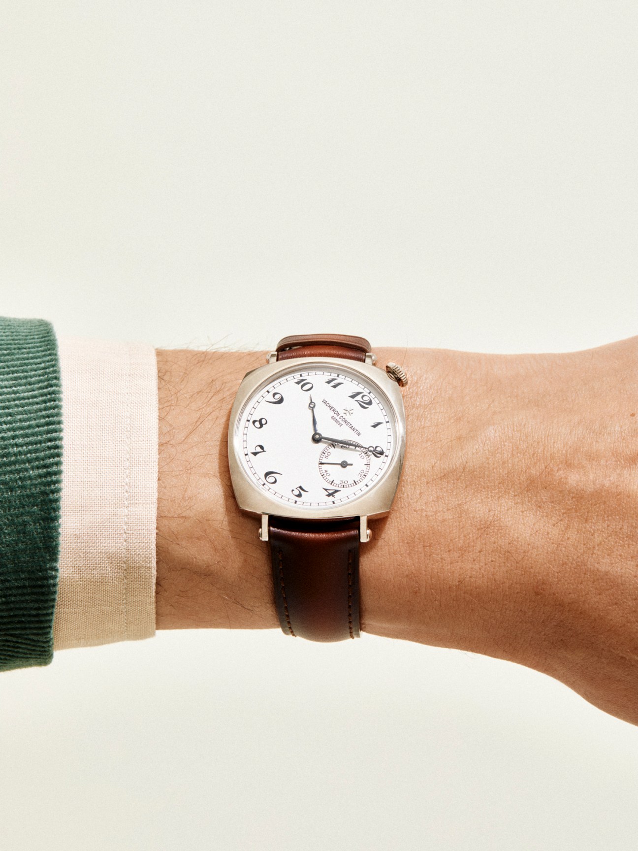 Historiques American 1921 watch by Vacheron Constantin worn on wrist showing white dial and brown leather strap