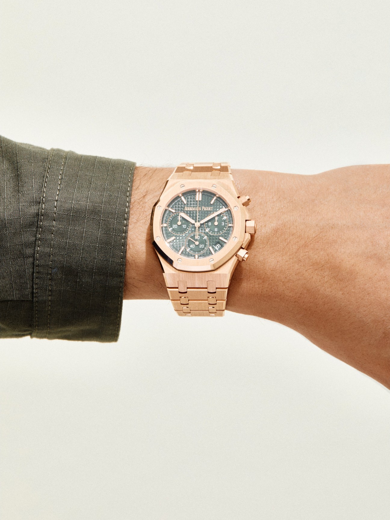 Royal Oak self-winding watch by Audemars Piguet with rose gold octagonal bezel worn on wrist