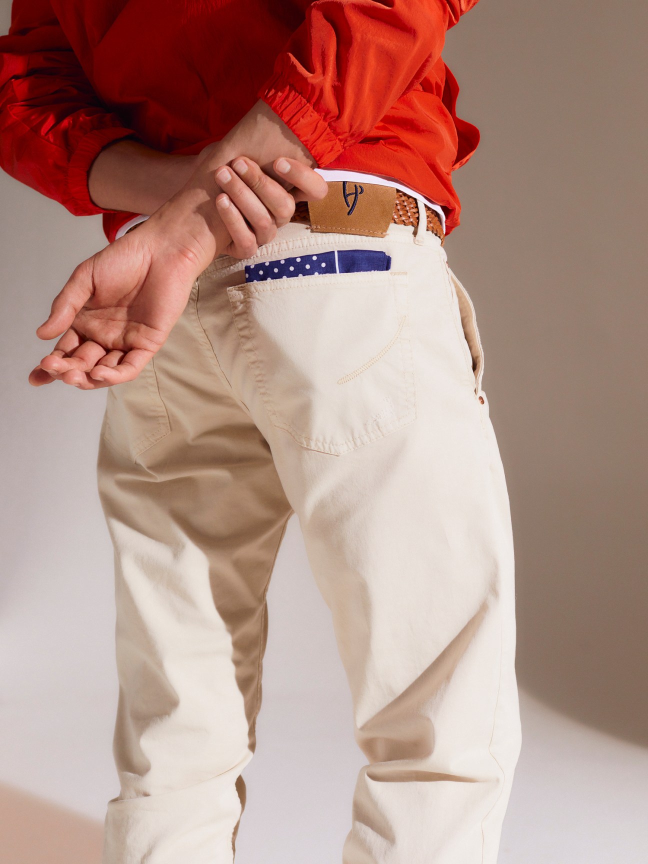 Man wearing white HandPicked jeans with denim jacket and accessories