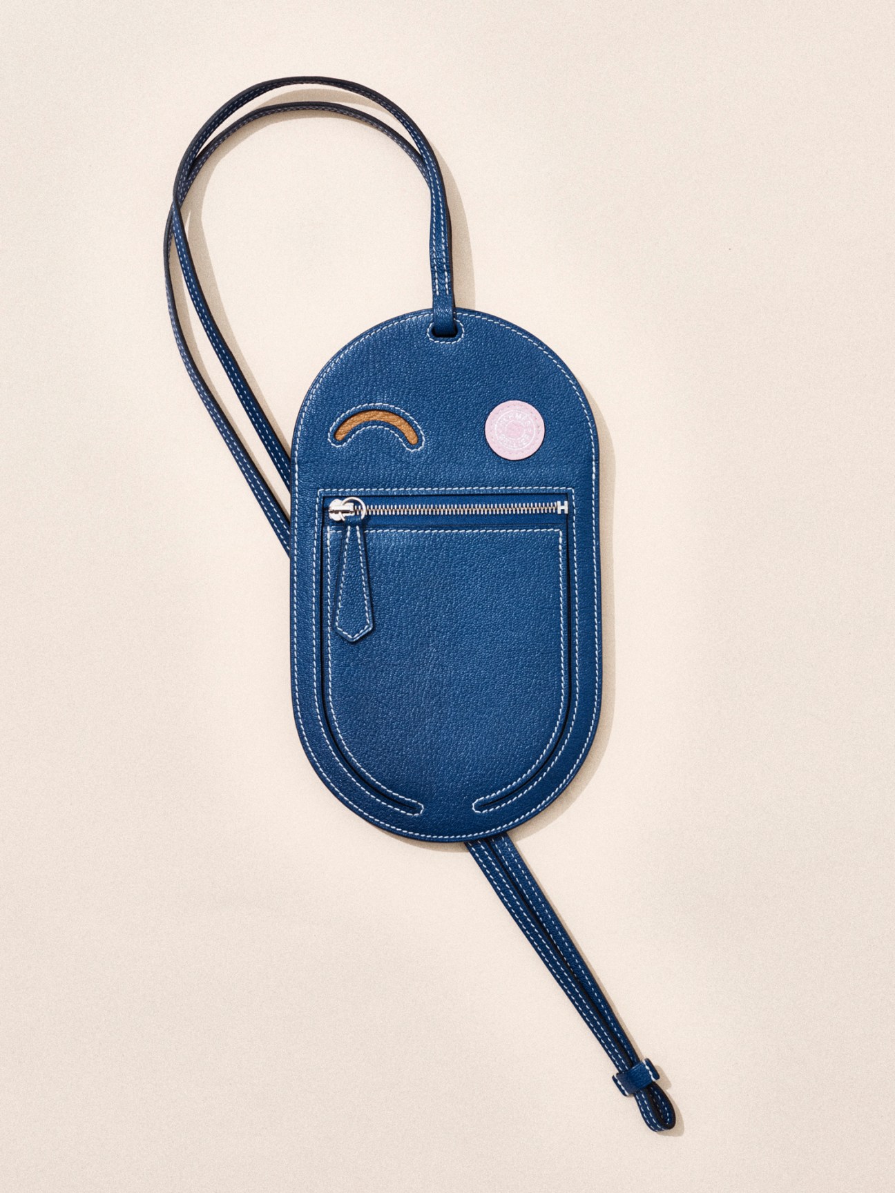 Blue leather wristlet bag with zipper pocket and adjustable strap by Hermès