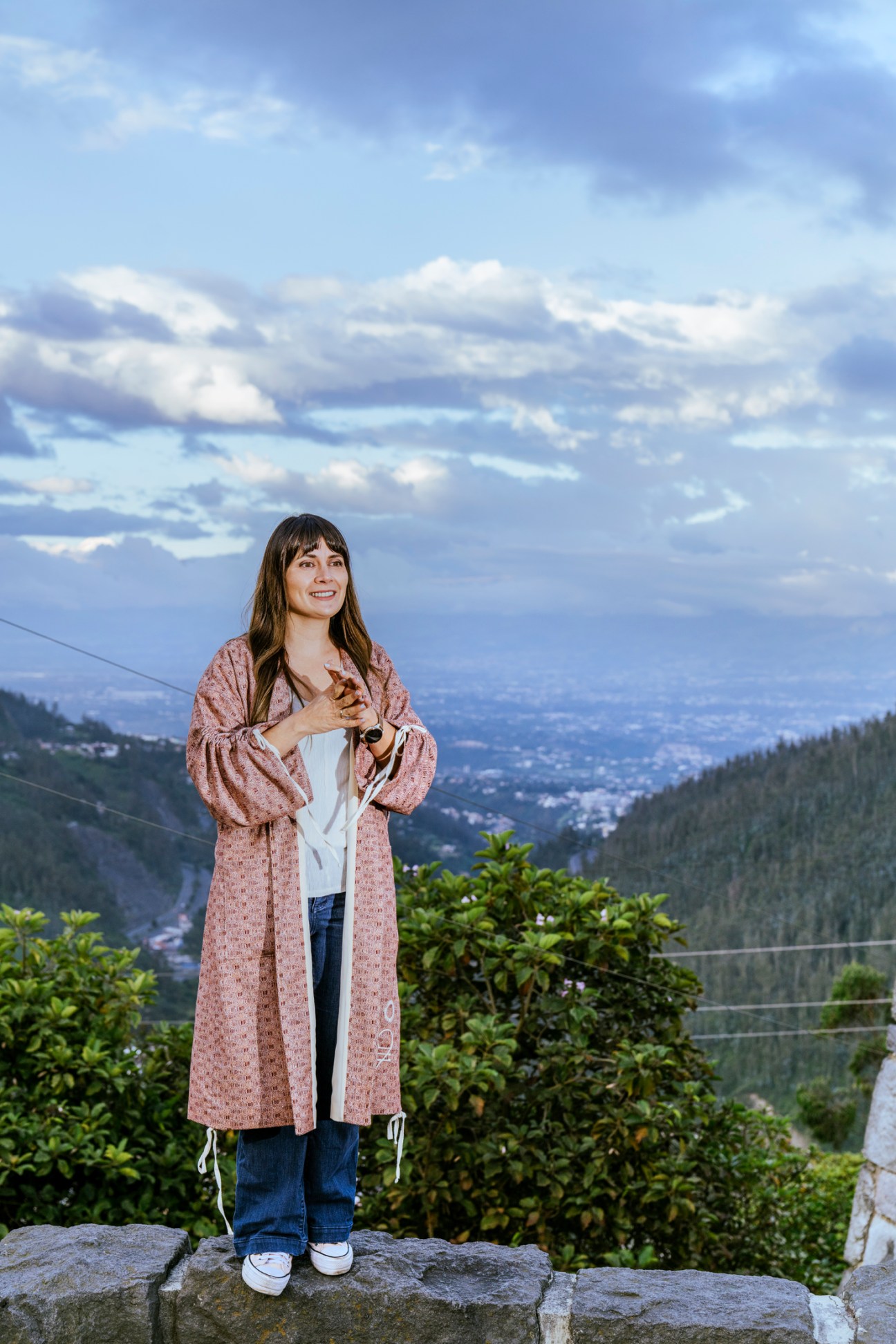 Michelle Arévalo-Carpenter sits in modern co-working space with contemporary furniture and mountain view