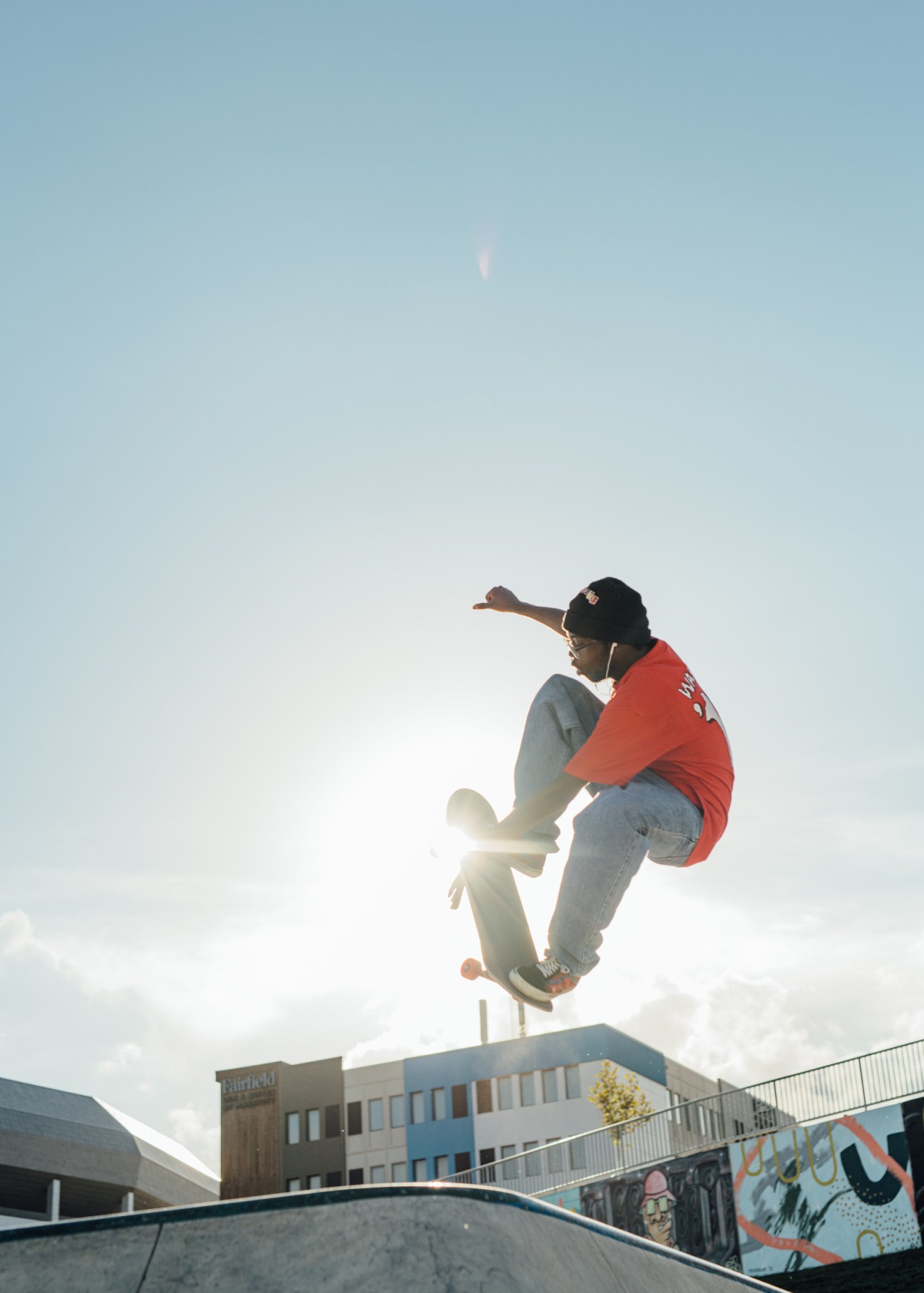 A skateboarder in a red jacket performs a trick at Lauridsen Skatepark in Des Moines, Iowa.