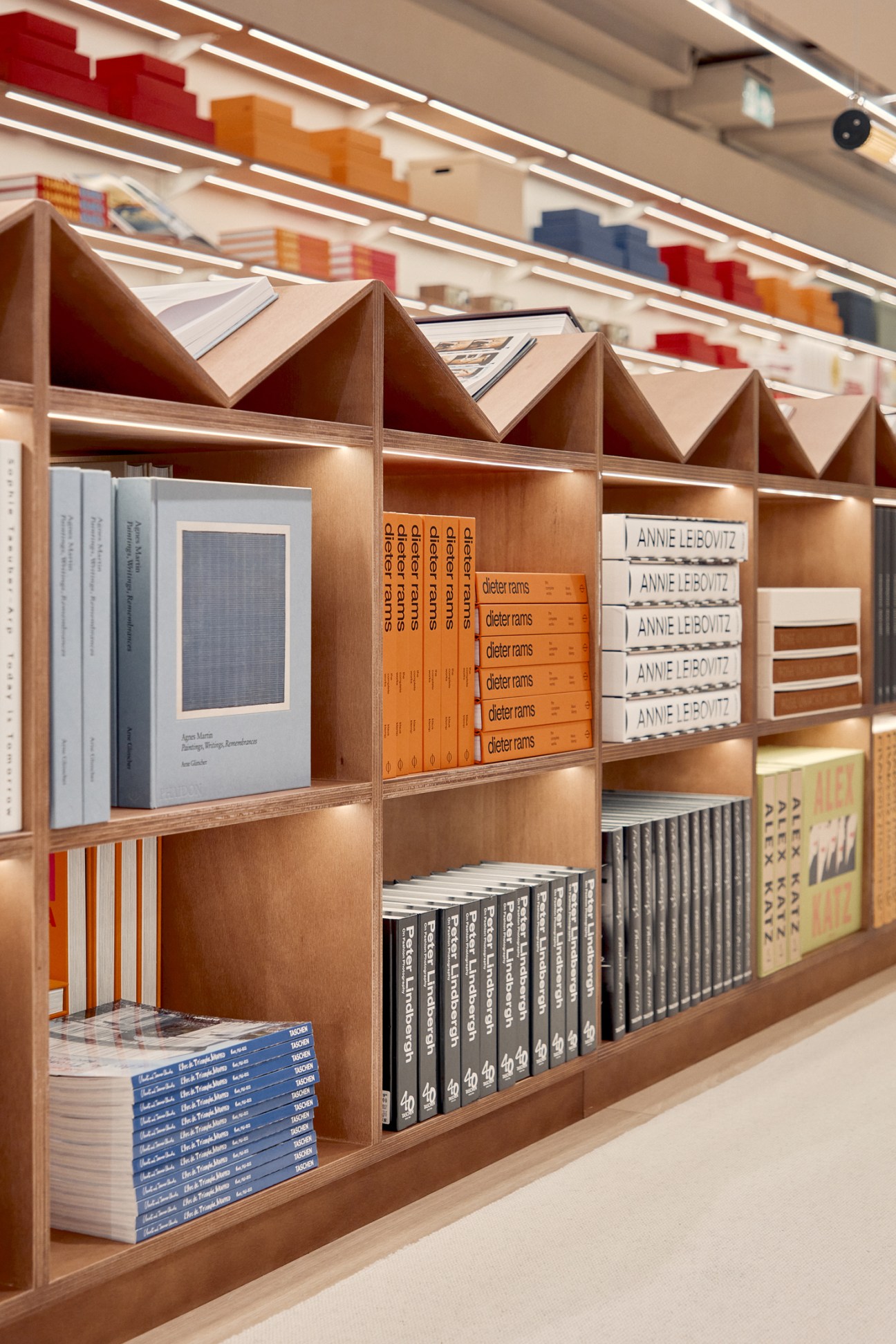 Design books open on desk showing 1930s functionalist design inspiration with geometric patterns