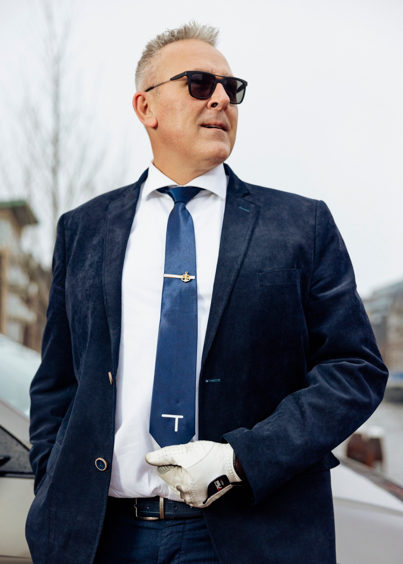 Saïd Bentarcha, entrepreneur who bought Travel Electric in 2021, wearing sunglasses and navy suit