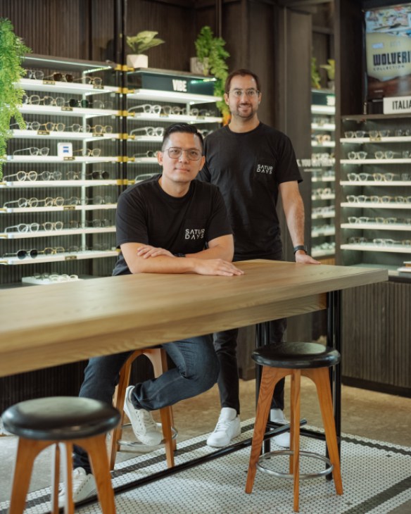 Two men standing together in business attire, founders Rama Suparta and Andrew Kandolha
