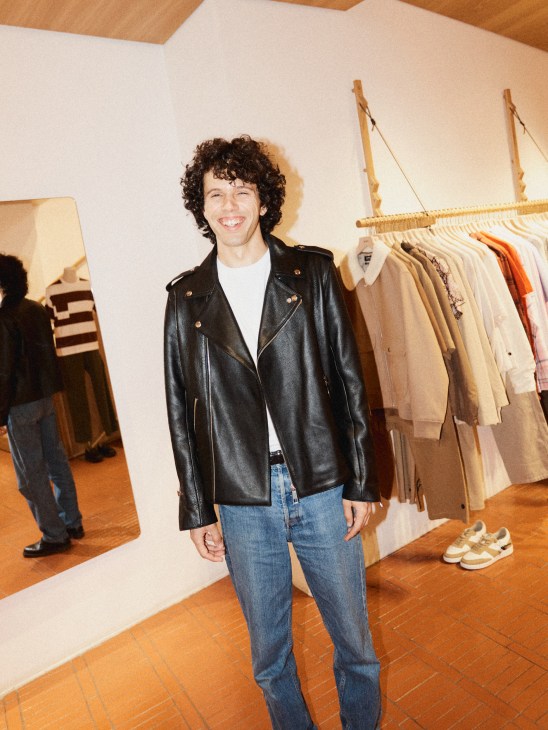 Model wearing APC x JW Anderson collaboration piece - textured wool duffle coat in neutral tones
