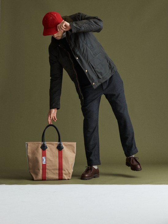 Model in casual jacket and cardigan layered look