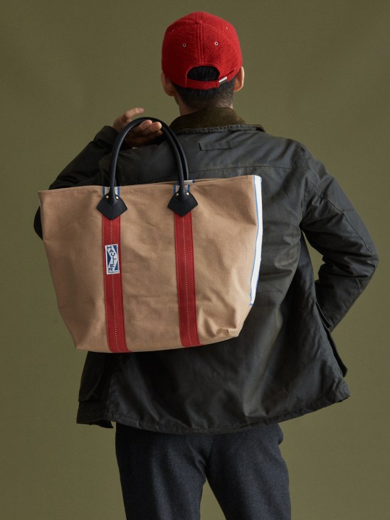 Model wearing beige cap and casual jacket