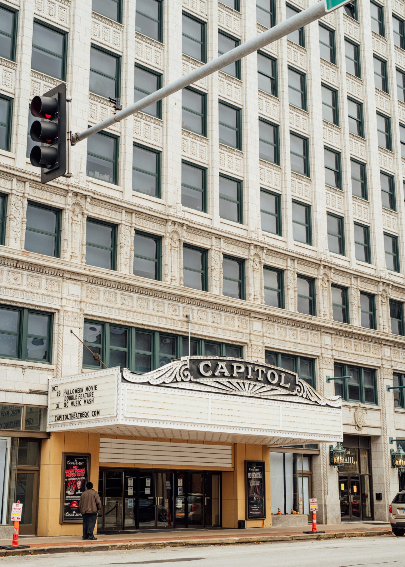 Restored Capitol Theatre facade in Davenport with ornate marquee and historic beaux-arts architecture.