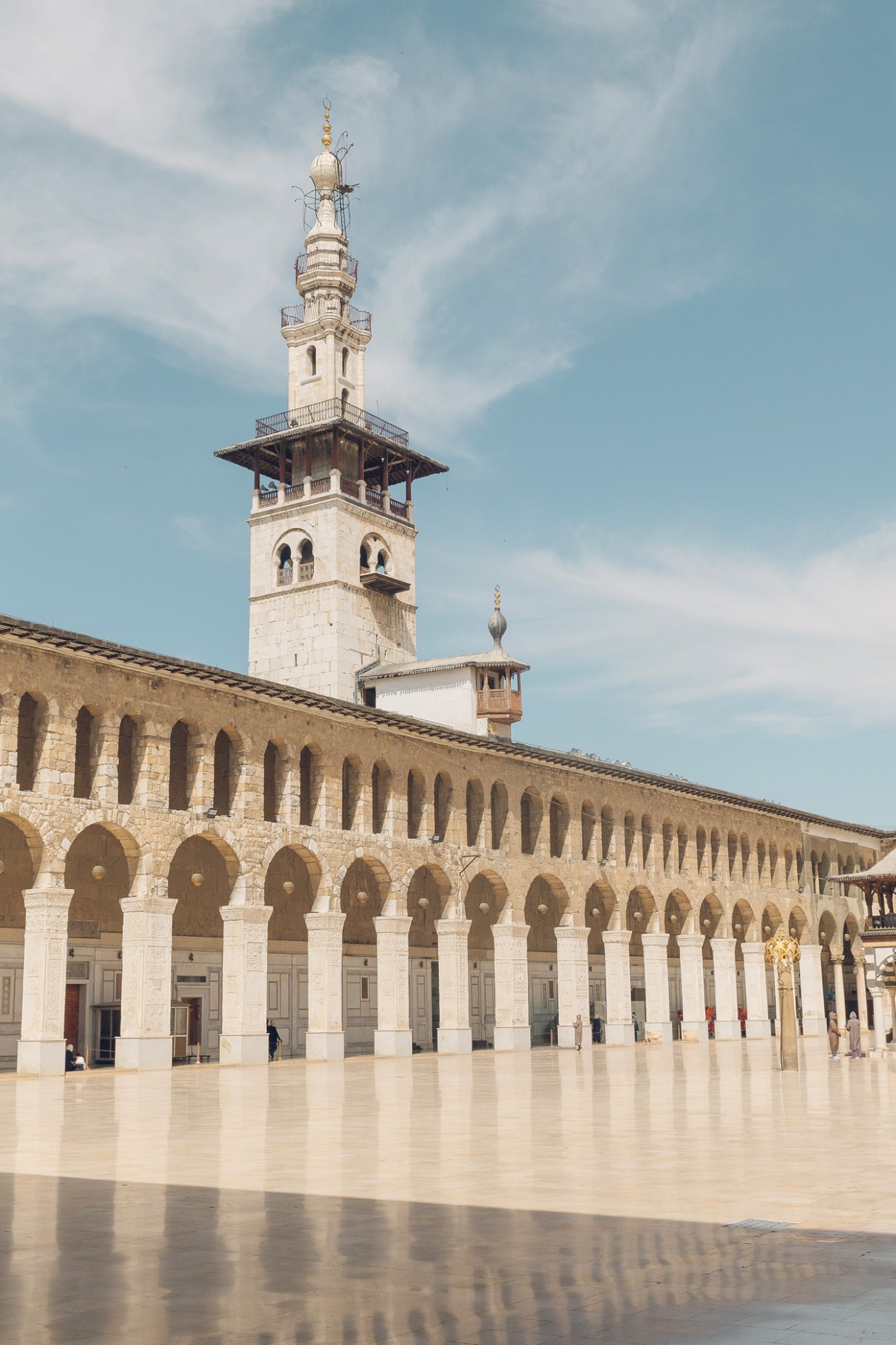 Interior view of the historic Umayyad Mosque in Damascus showing ornate Islamic architecture and columns