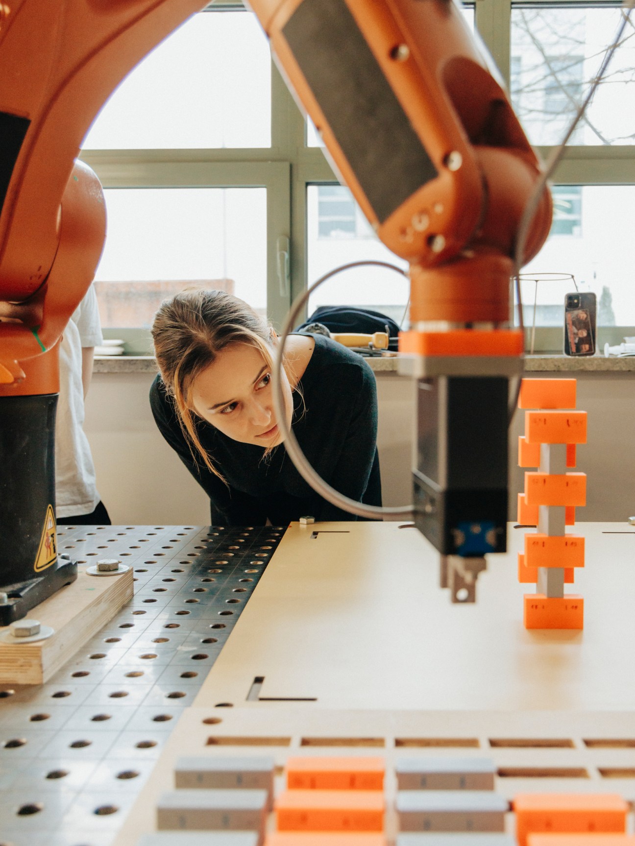 Student working in robotics workshop at School of Form