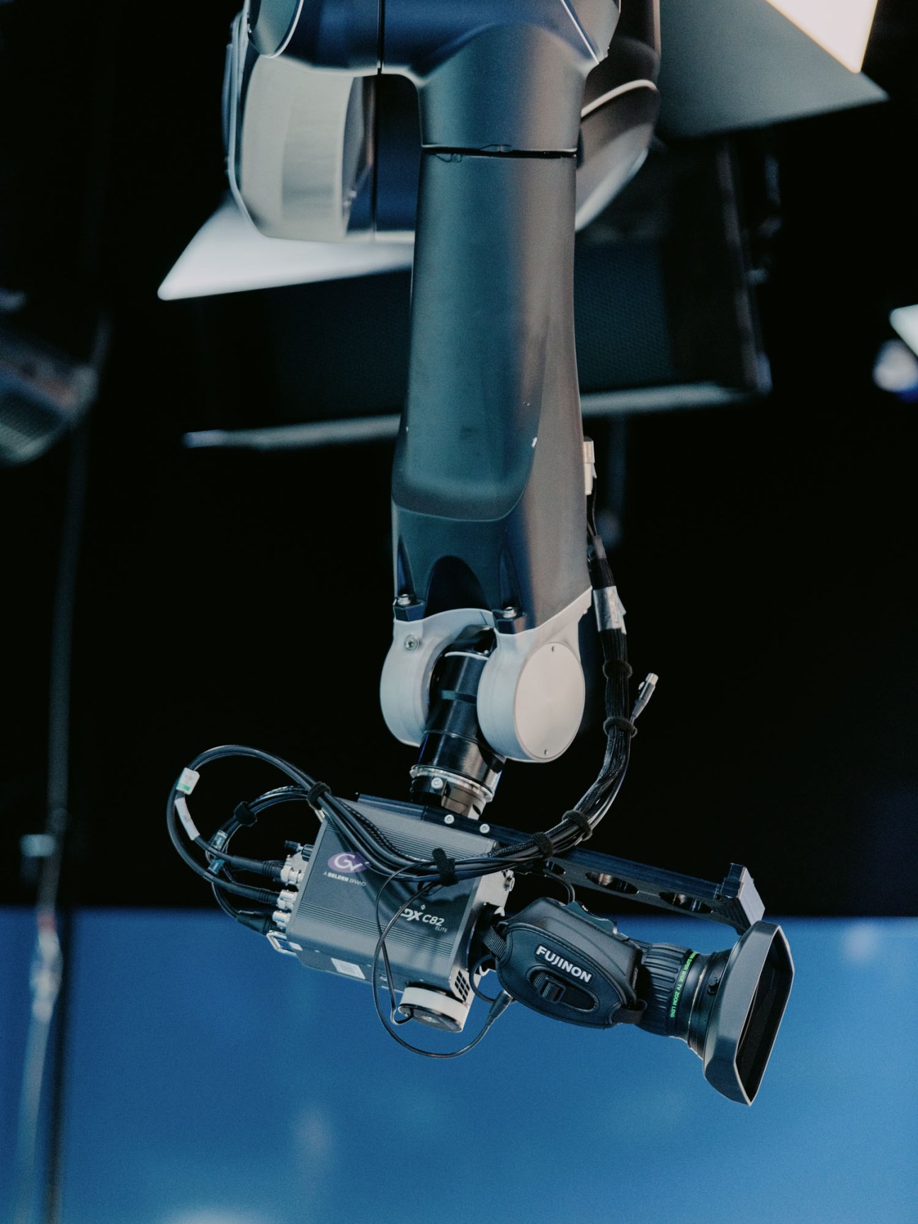 Television camera zooming in for close-up shot of news presenter