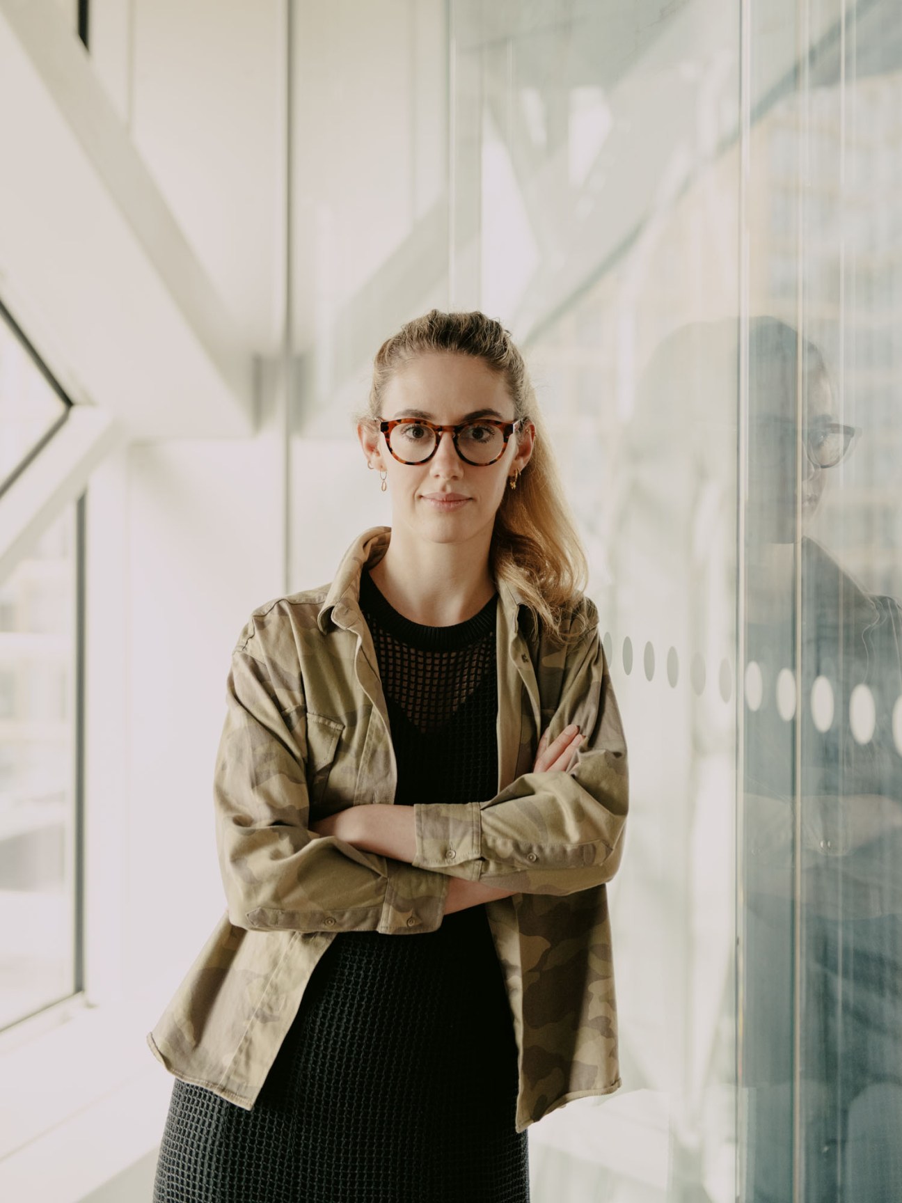 Franziska Zimmerer, head of community and social at Welt, standing with arms crossed in modern office