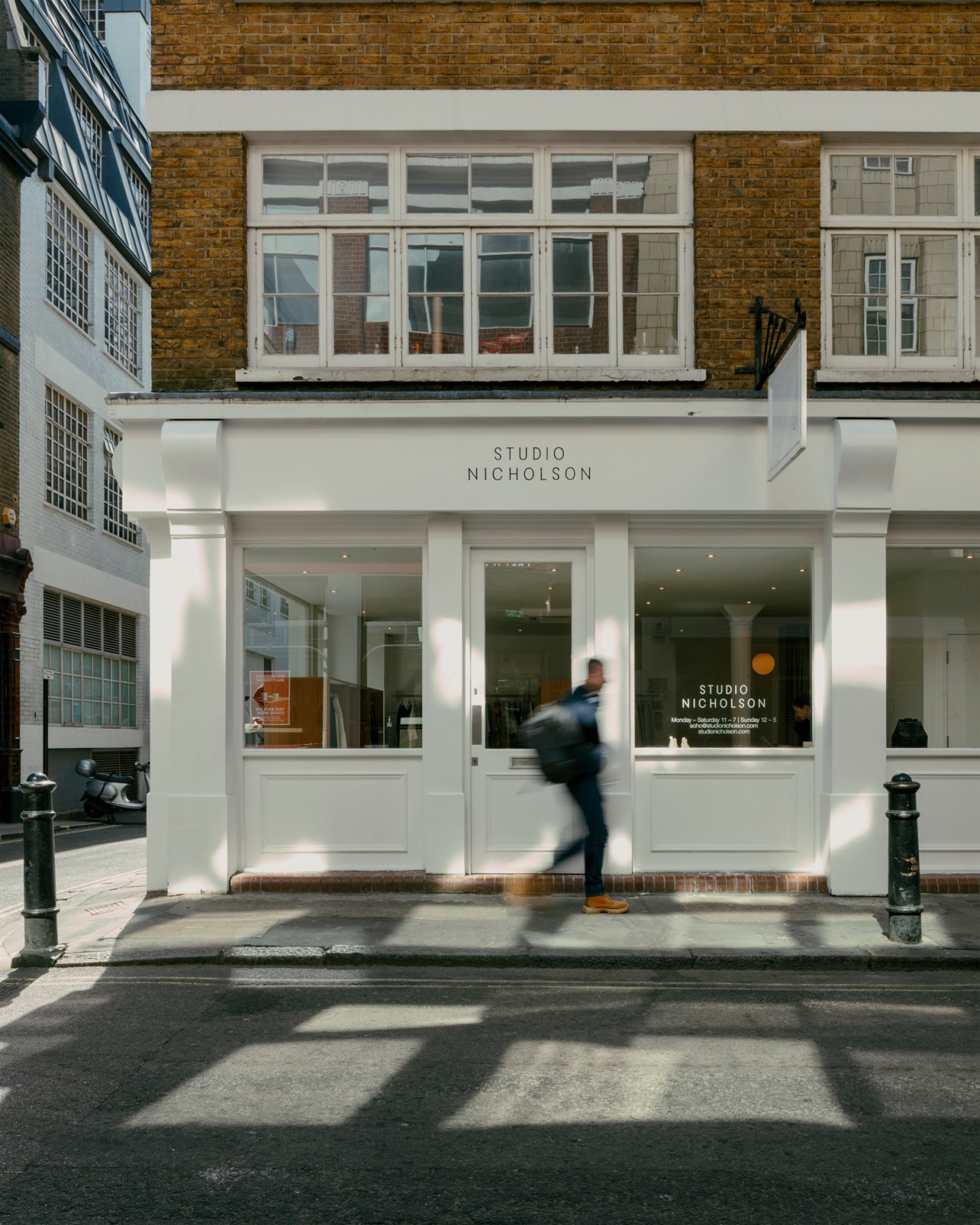 Interior of Studio Nicholson London store showing clothing displays and modern retail fixtures