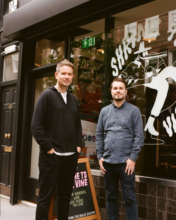 Dan Keeling and Mark Andrew stand outside Shrine to the Vine, their wine shop in London.
