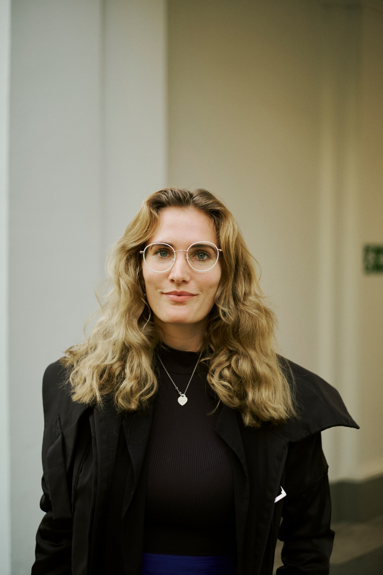 Portrait of Julia Höftberger, an Austrian student, in an academy corridor