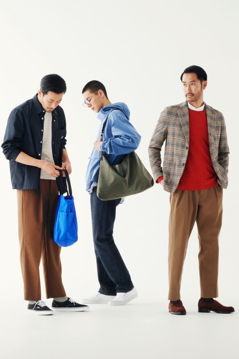 Three men wearing smart casual outfits with jackets, trousers, and accessories against a white background.