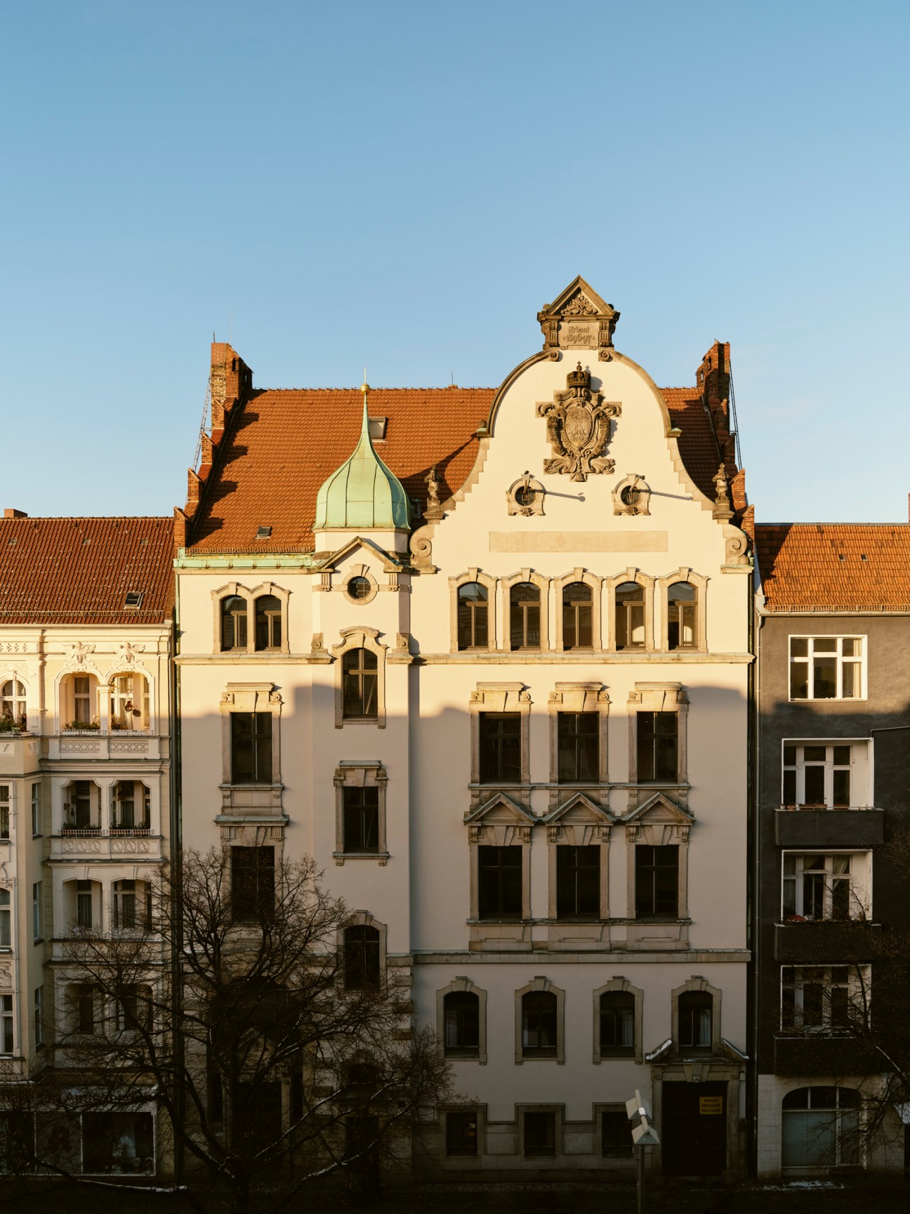 Ornate façade of former Charlottenburg Criminal Court building with decorative stonework and curved parapet