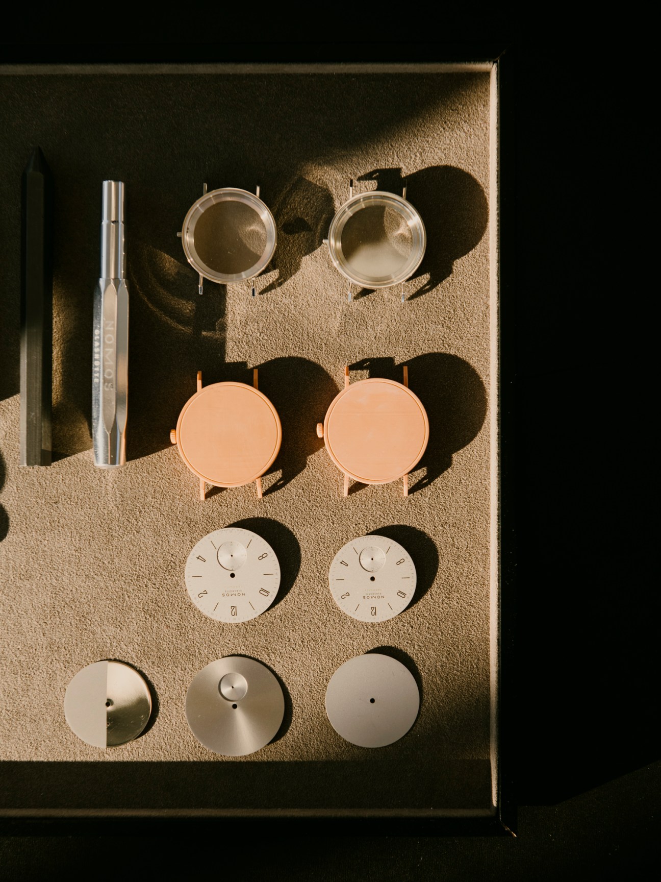Watch craftsperson working on intricate watch mechanism components