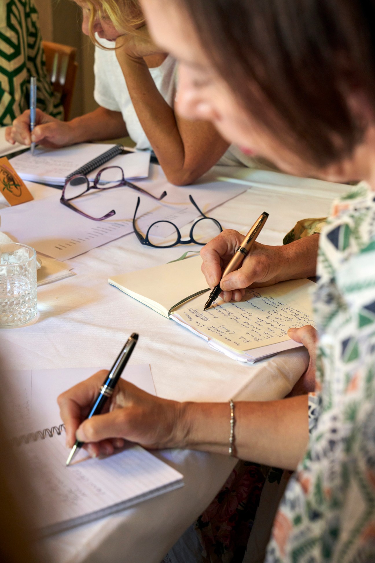 Writing materials and notes during creative writing session