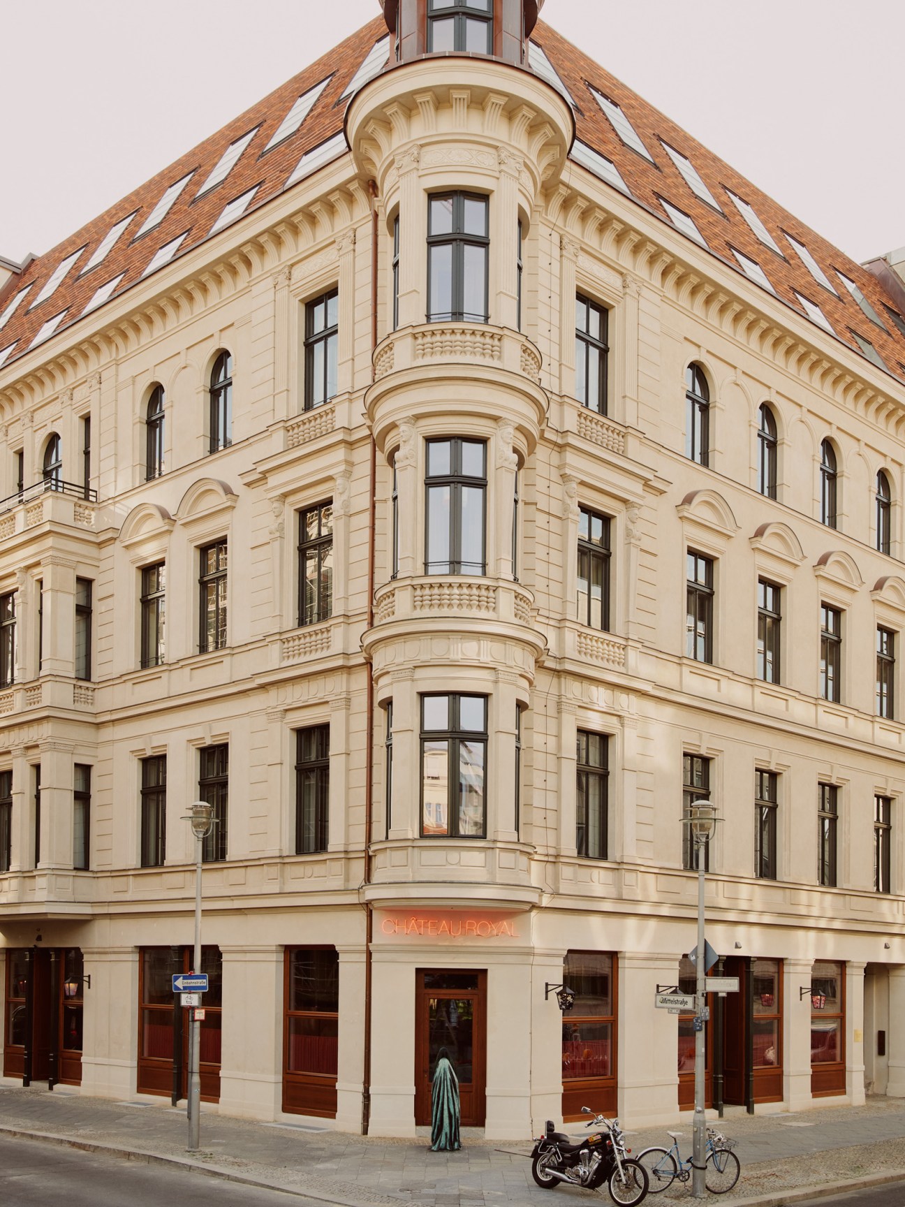 Château Royal Berlin exterior showing historic corner building with ornate architecture and red tile roof