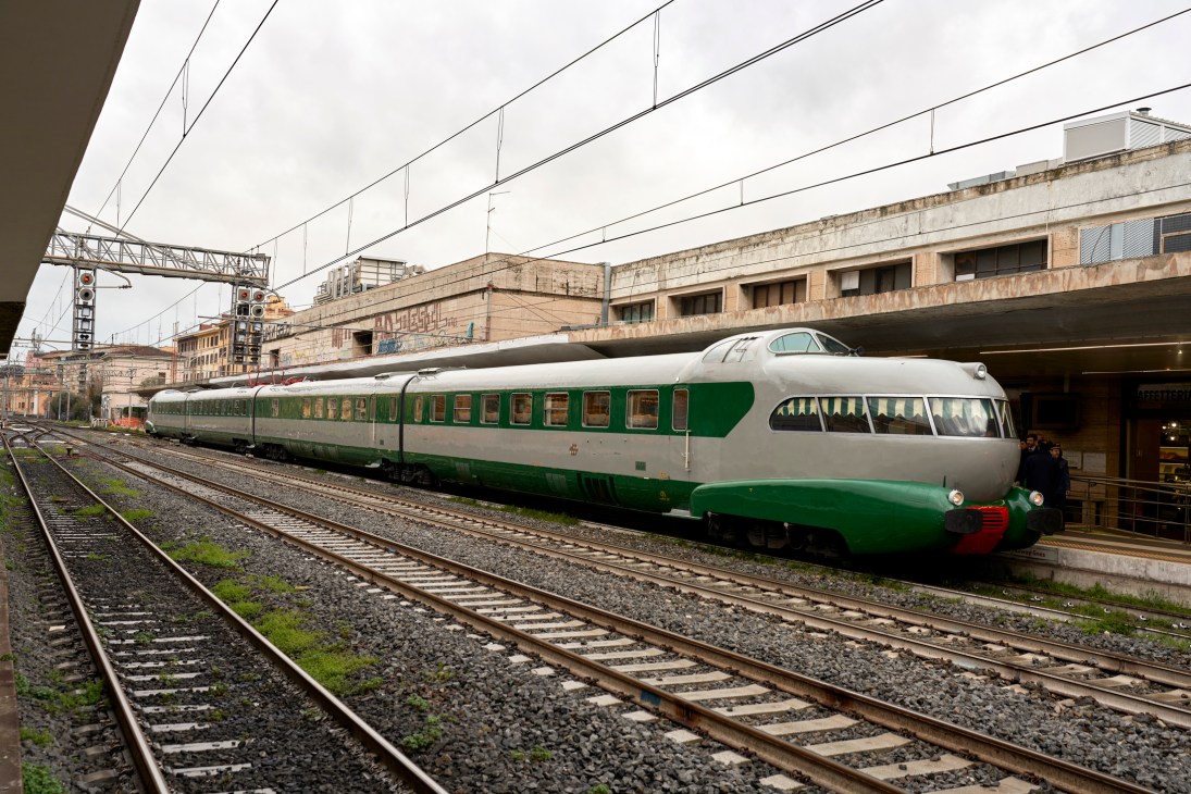 The distinctive aerodynamic nose of the ETR 252 L'Arlecchino train at Rome Ostiense station platform