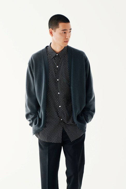 Male model wearing The Library cardigan, Heugn shirt, and Acne Studios trousers.
