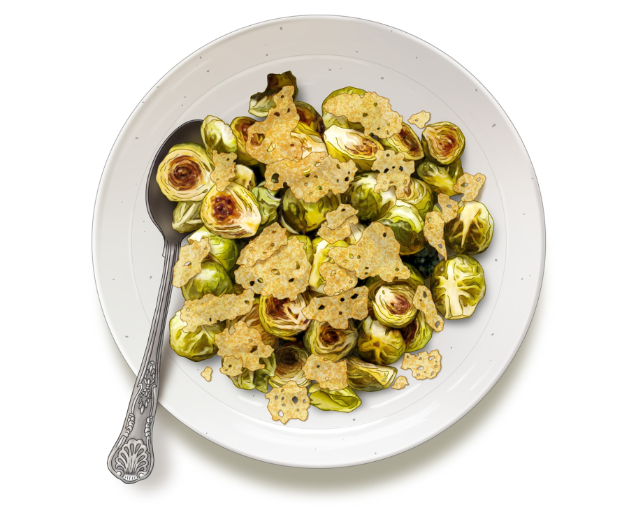 Roasted Brussels sprouts topped with golden parmesan crisps and lemon zest on a white plate