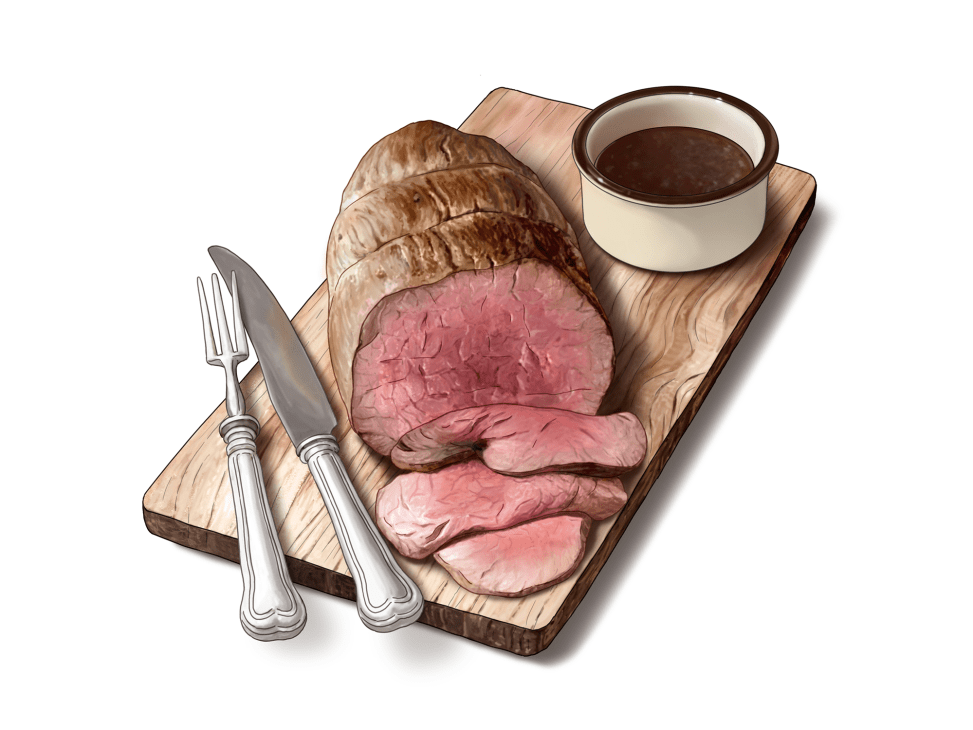 Sliced roast beef on wooden cutting board with carving knife, fork, and small cup of dark sauce