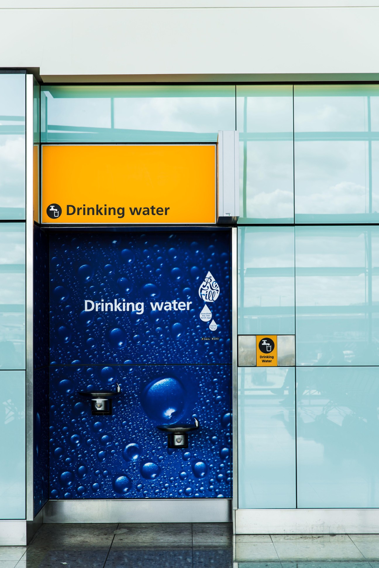 Modern water refill station at an international airport with sleek design