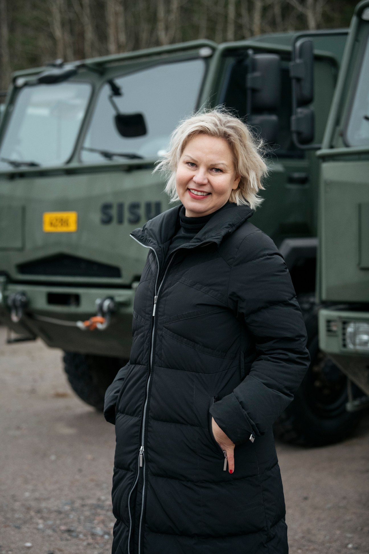 Participant Henna Helander, president of Finnish Association of Architects, wearing black winter coat outdoors