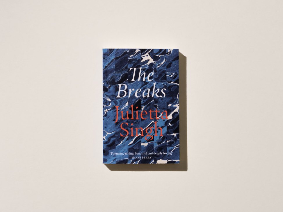 Book cover of 'The Breaks' by Julietta Singh with blue marbled pattern background