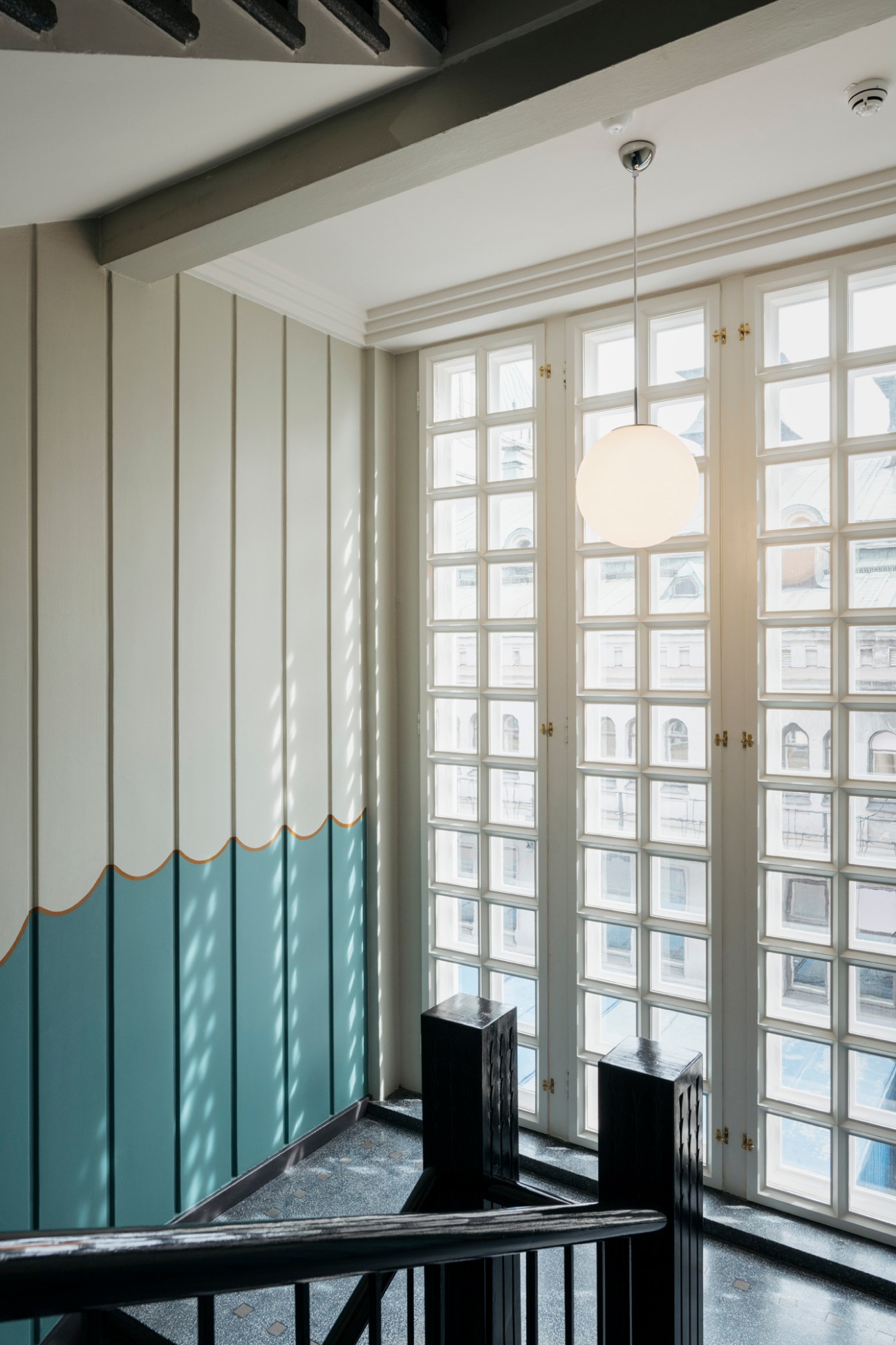 Restored staircase with original Eliel Saarinen ornamental wooden railings and pillars