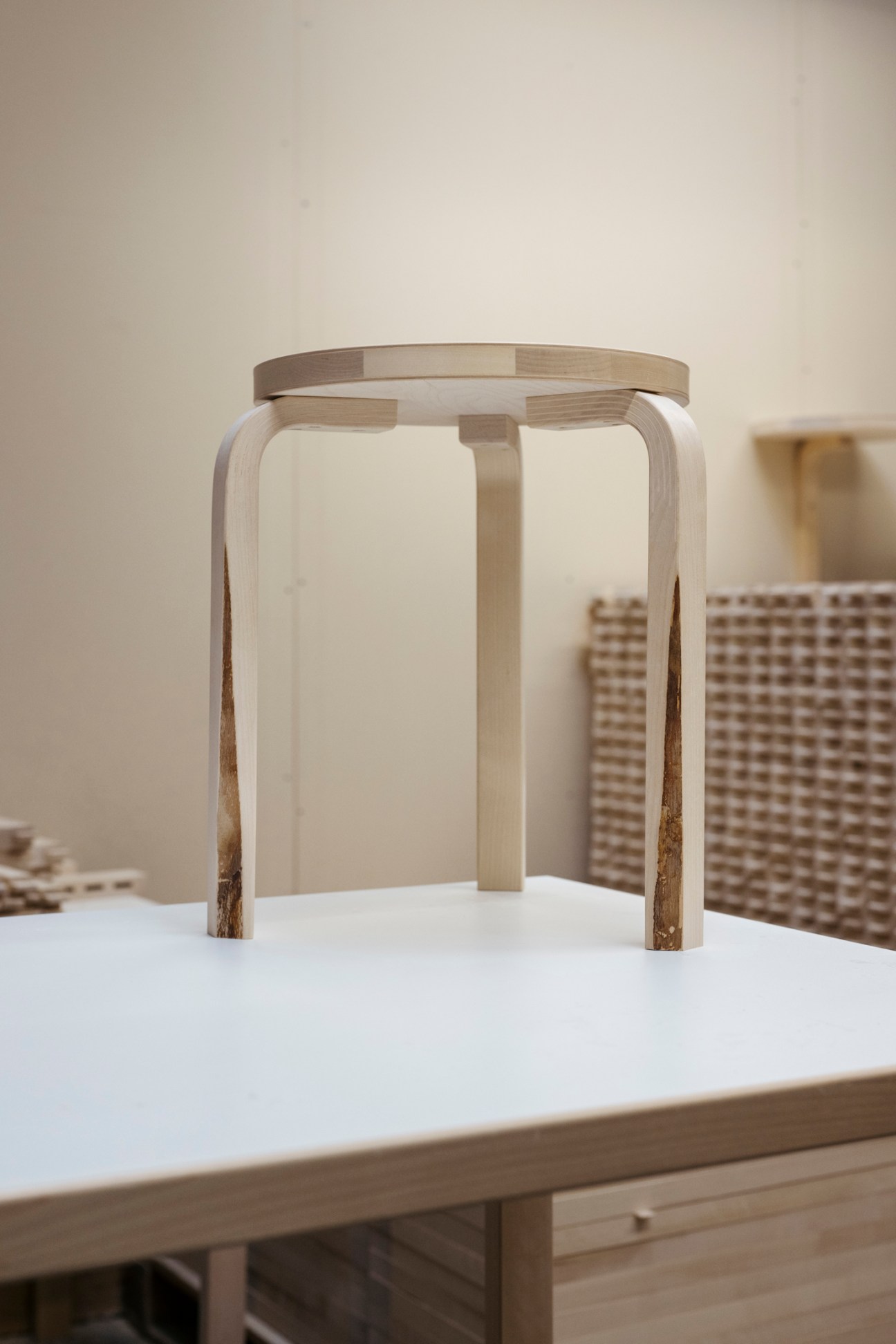 Limited-edition Stool 60 featuring natural bark elements, showing the acceptance of wood's natural imperfections