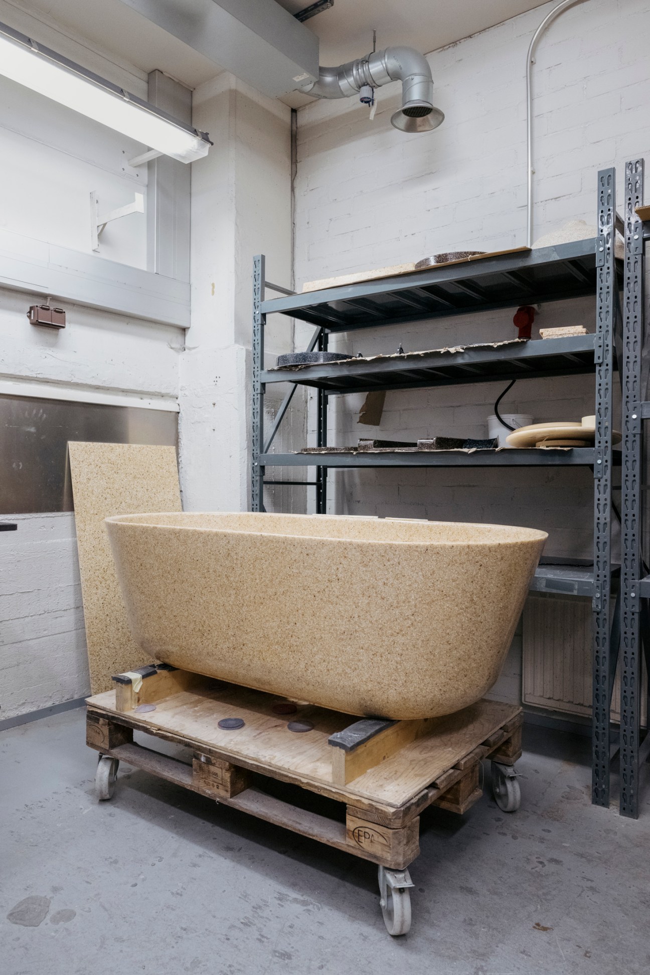 Modern wooden bathtub made from Woodio's wood composite material, demonstrating waterproof wood technology