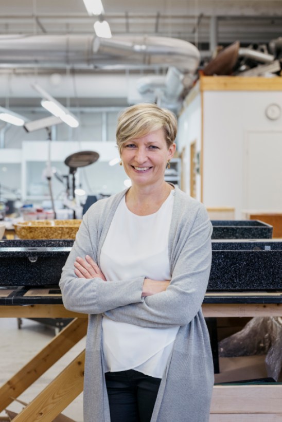 Portrait of Terja Koskenoja, CEO of Woodio, in their factory setting